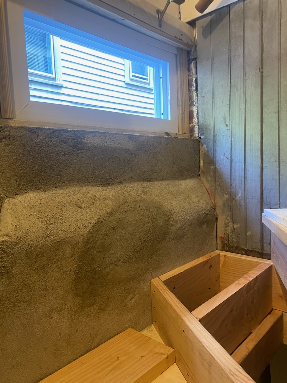 Raw concrete basement before stair construction