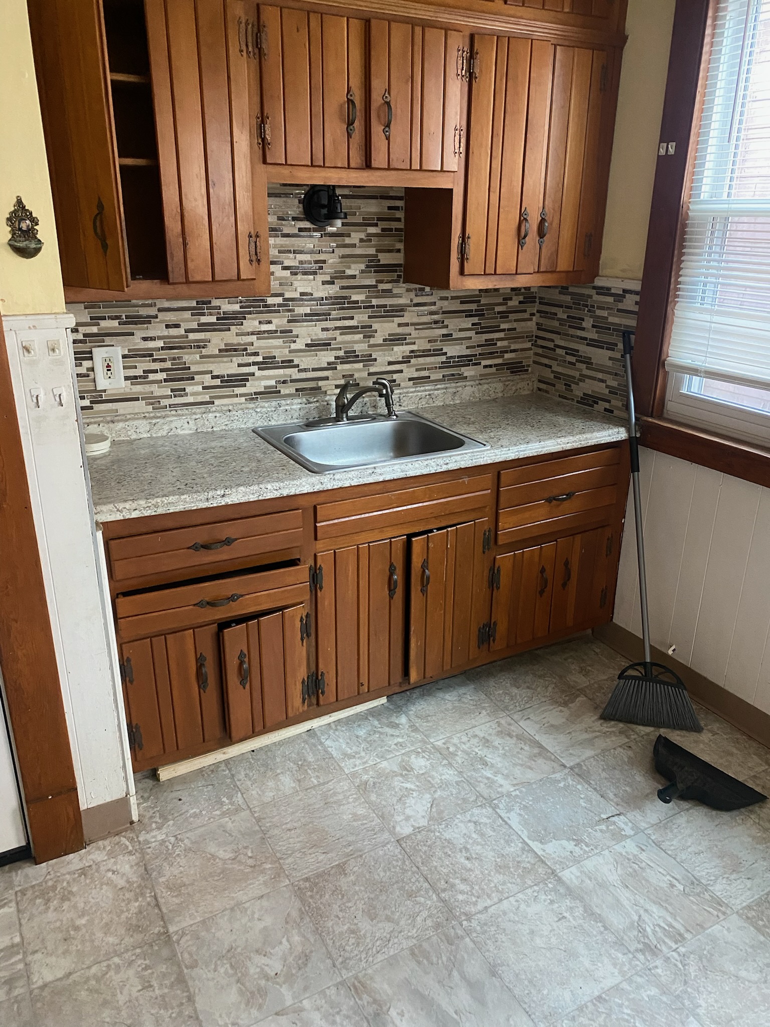 Original kitchen with deteriorated cabinet doors