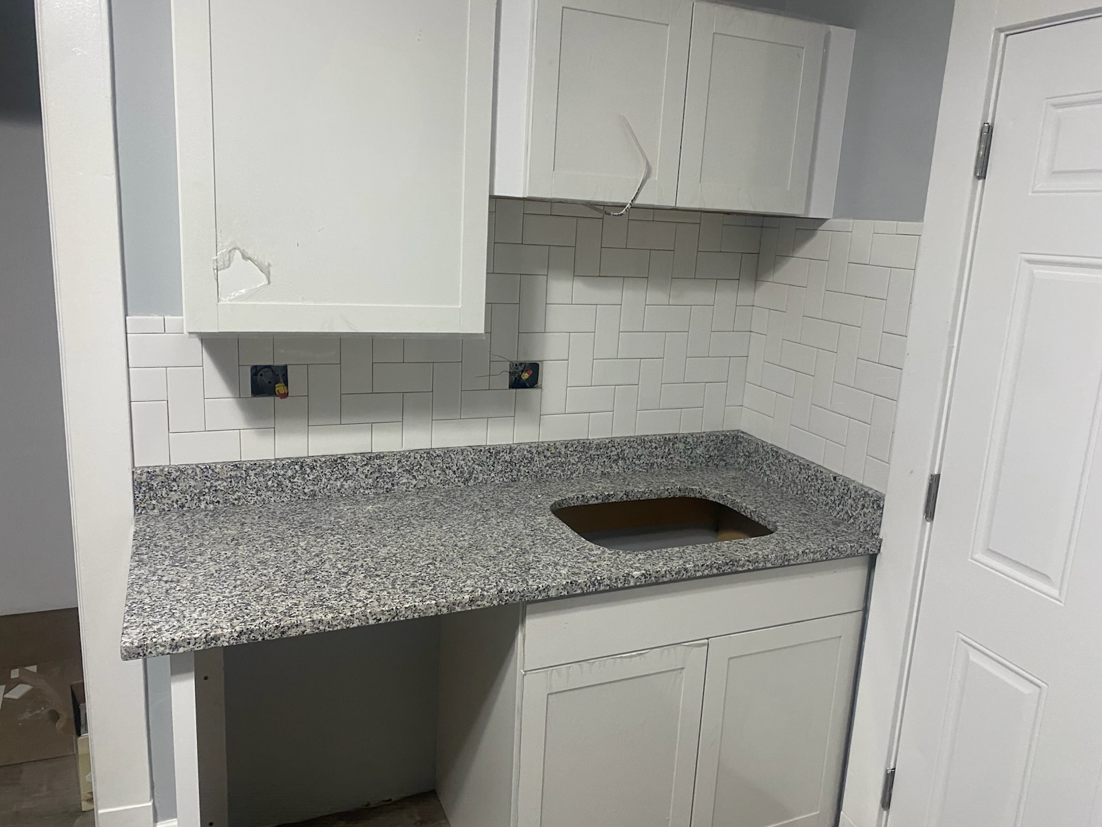 Granite countertops installed, sink cutout ready