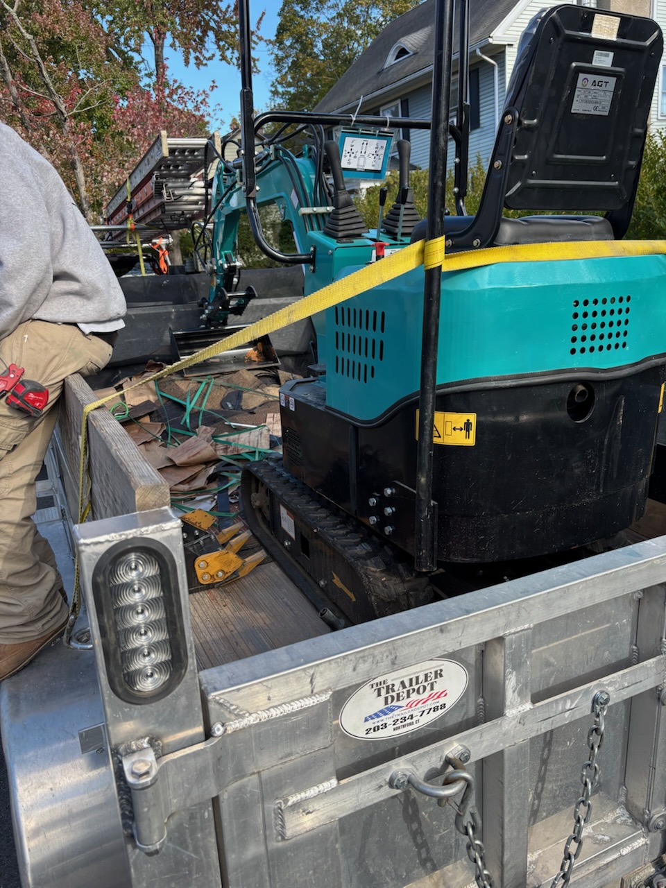 Mini excavator on trailer ready for transport