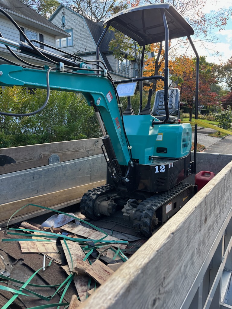 Mini excavator on job site